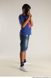 TIMBO STANDING POSE WITH GUN